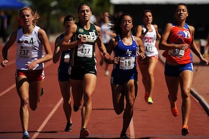 photo of student athletes in a race on a track
