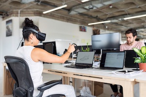 Photo by ThisIsEngineering of Woman Using Laptop Computer With VR Headset. Source: Pexels