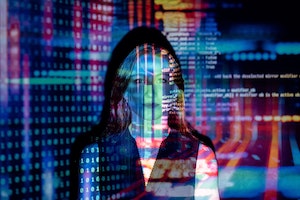 Photo by ThisIsEngineering of a woman with computer screen image superimposed